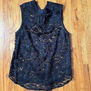 Sleeveless black lace top.